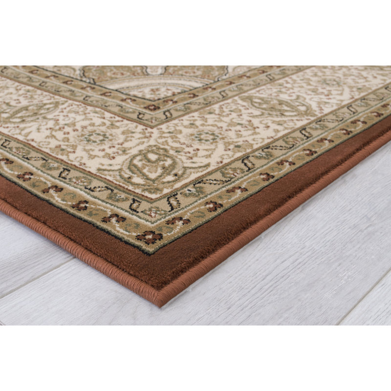 Harpersville Oriental Area Rug in Brown/Ivory