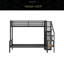 Lit superposé simple au-dessus d'un lit double en métal avec escalier de rangement et garde-robe ouverte-1079563711