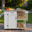 Îlot de cuisine extérieur avec plateau en acier inoxydable, serviette, étagères à épices, armoire, espace de rangement ouvert et tiroir-125506561