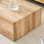 Table basse moderne en bois aggloméré avec une texture de grain de bois naturel, une finition lisse, une fabrication robuste et une conception prête à l'emploi pour l'élégance du salon.