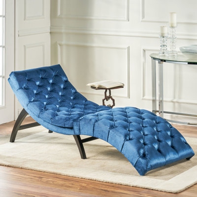 Chaise longue antique en velours bleu marine pour une expérience confortable avec base stable