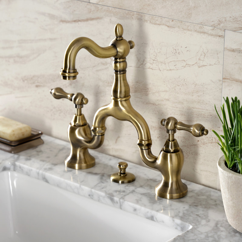 Kingston Brass English Country Two-Handle 3-Hole Deck Mount Bridge Bathroom Faucet with Brass Pop-Up, Antique Brass