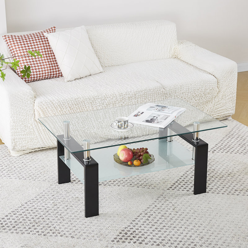 Table basse rectangulaire moderne en verre trempé noir, 100 cm (L) x 60 cm (P) x 45 cm (H), avec tablette de rangement inférieure.