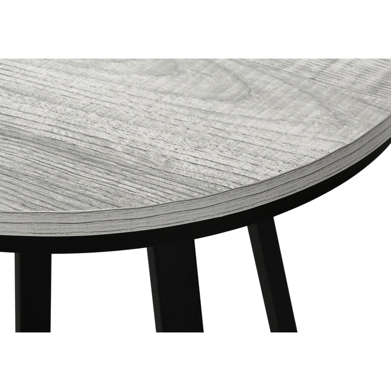Table ronde élégante pour espaces de vie - Matériaux stratifiés gris et métal noir, style moderne, idéale pour une salle familiale.