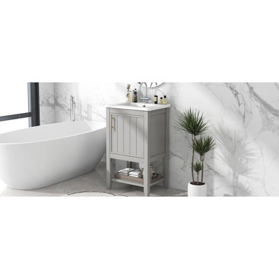 Meuble-lavabo de 50 cm avec lavabo en céramique, porte à fermeture amortie, poignée-barres et finition anti-taches grise. Armoire simple de 50 cm avec tablette de rangement et tablette ouverte décorative.