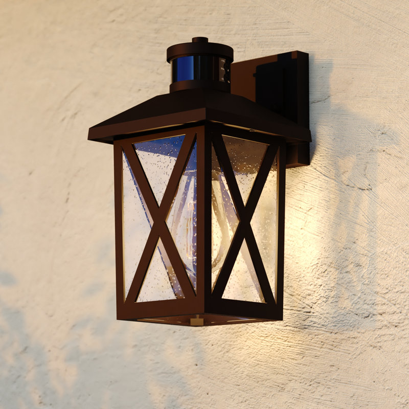 Rockford 11 in. H 1-Light Bronze Outdoor Wall Light with Motion Sensor and Dusk to Dawn, Built-In GFCI Outlet, Rust-Resistant Aluminum, Ideal for Porch, Patio, Front Door or Garage