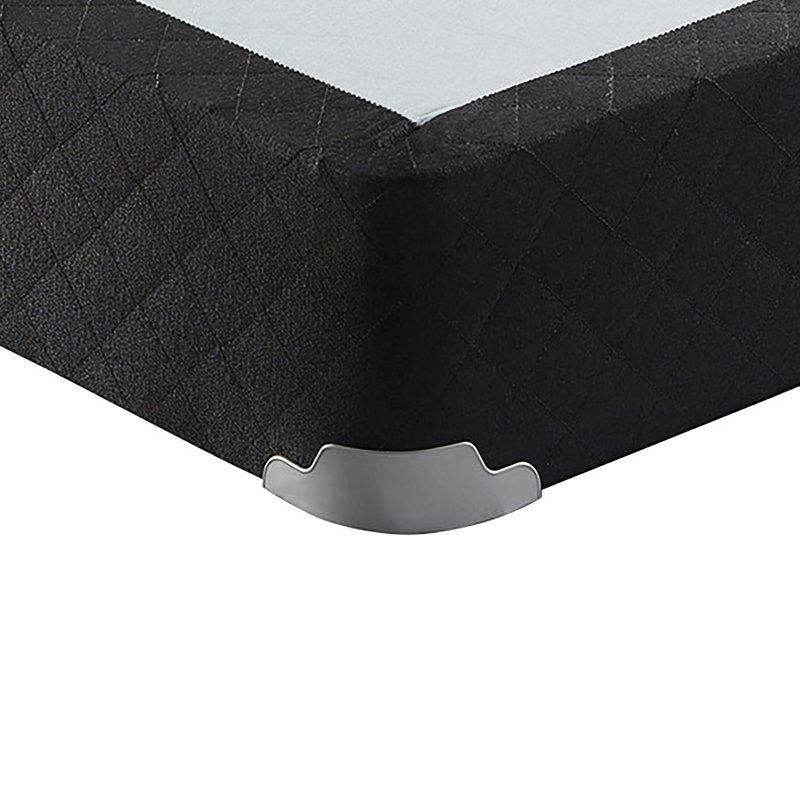 Sommier gris simple, matelas surélevé, respirant, favorisant la circulation de l'air et la fraîcheur dans la chambre à coucher