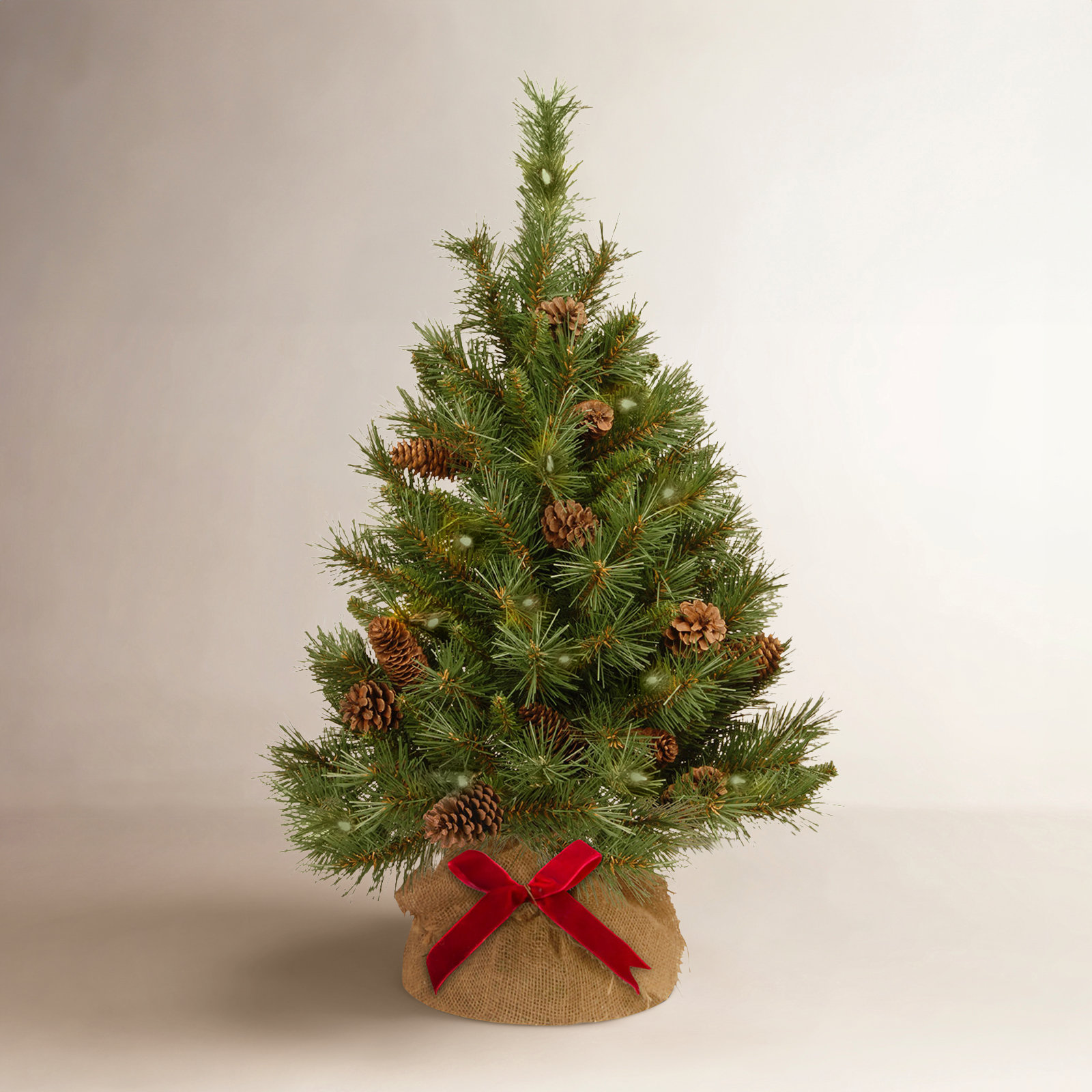 The Holiday Aisle® 3ft. Pine Cone Tree in Burlap Base with LED Lights