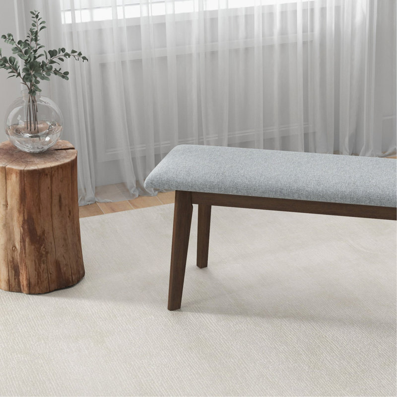 Banc en bois massif revêtu de tissu Carlos