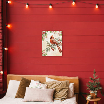 Cardinal sur toile de branche de houx, design par Nicole DeCamp