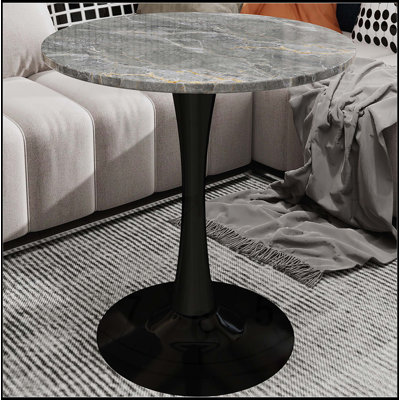 Table d'appoint ronde avec base piédestal effilée, idéale pour le salon, design minimaliste moderne