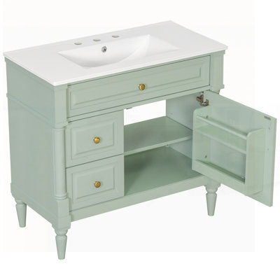 Meuble-lavabo autoportant avec lavabo en céramique, tiroir rabattable, tablette réglable, structure en bois d'hévéa, panneaux de fibres à densité moyenne et finition peinte en vert