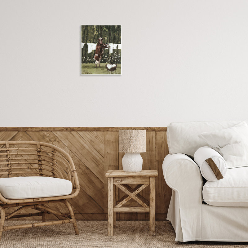 Vache faisant la lessive, art mural par échelle blanche