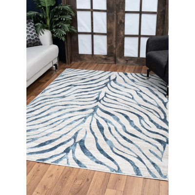 Élégant tapis bleu avec une texture lisse et une durabilité durable avec une hauteur de poils de 0,32 po pour les vestibules sous les meubles