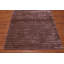 Tapis mauve touffeté à la main