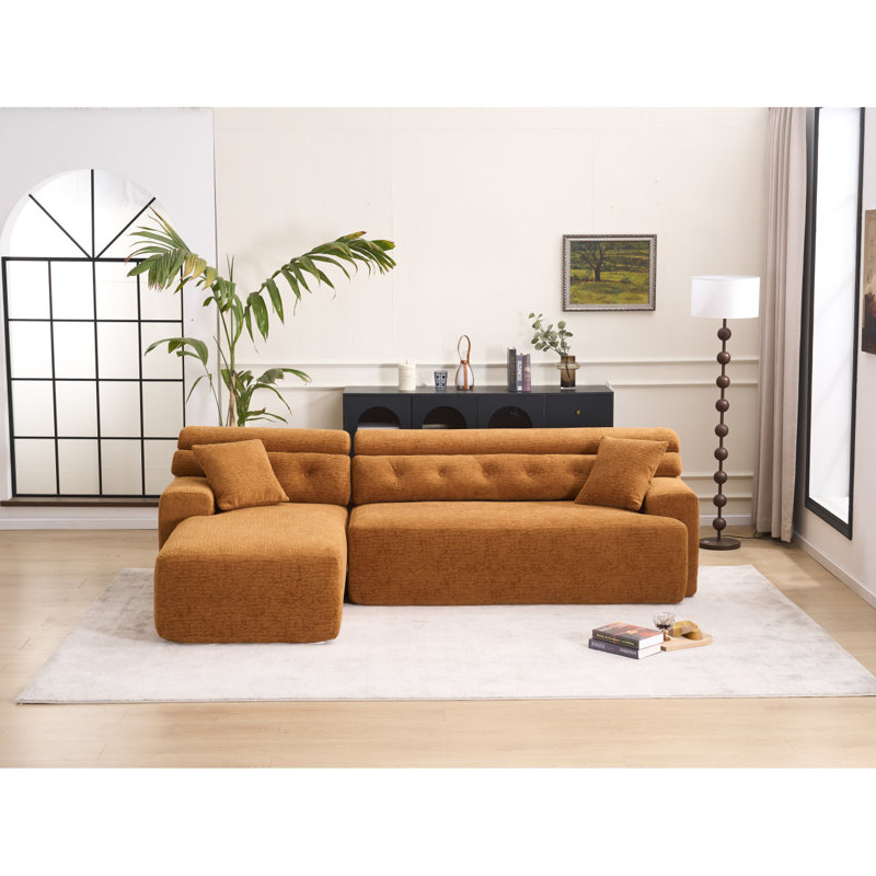 Luxueux canapé à compression en L avec accoudoirs plus larges et siège plus profond, parfait pour un confort et un style ultimes