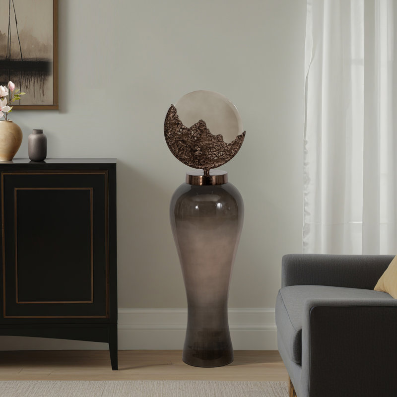 Decorative Glass and Metal Jar with Sculptural Artistic Lid Accent in Glam Style Featuring Elegant Silhouette and Textured Round Topper for Modern Luxe Appeal and Eye-Catching Visual Interest