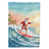 Père Noël surfant sur le Pacifique