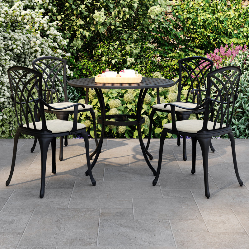 4 - Person Patio Dining Set with Round Table , Cushions Included