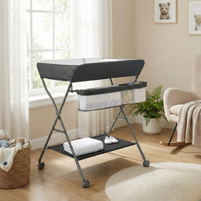 Table à langer pliante portative avec roues - Station de couches réglable en hauteur avec coussin imperméable et organisateur de rangement pour chambre de bébé