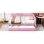 Lit double rembourré rose avec lit gigogne simple pour une chambre à coucher relaxante et pratique