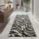 Tapis à motif imprimé animal noir Dondre