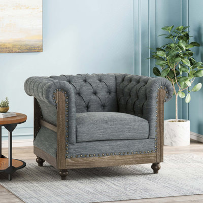 Fauteuil club capitonné
