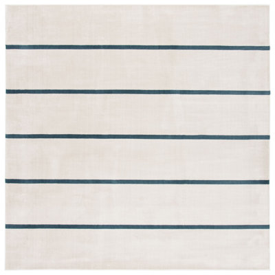 Aslin Striped Ivory / Navy Area Rug