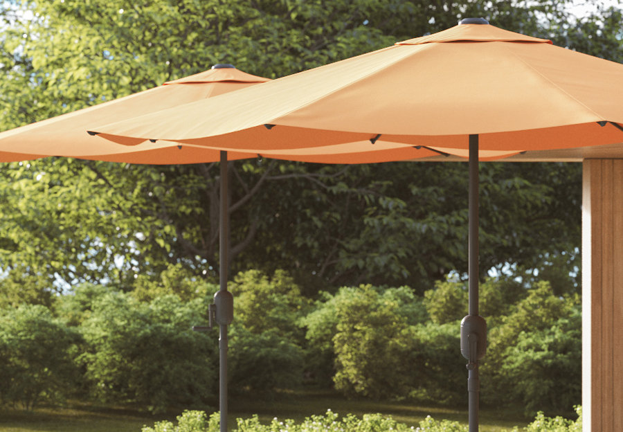 2 orange patio umbrellas that look like they are intended for a commercial space