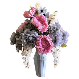 Arrangement floral mélangé dans un vase