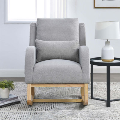 Fauteuil à bascule de salon moderne à dossier haut avec coussin lombaire et poches latérales pour un confort et une détente modernes