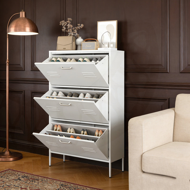 Armoire Trera avec 3 tiroirs rabattables et une structure en métal pour l'organisation du vestibule et un design peu encombrant.