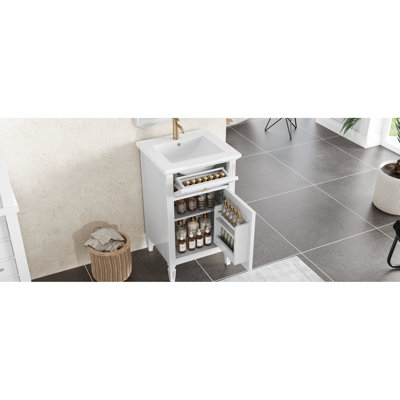 Meuble-lavabo blanc de 50 cm avec pieds en bois massif, tiroir inclinable et charnières à fermeture en douceur, idéal pour les petites salles de bain. Lavabo intégré, finis en métal doré, convient également aux invités.