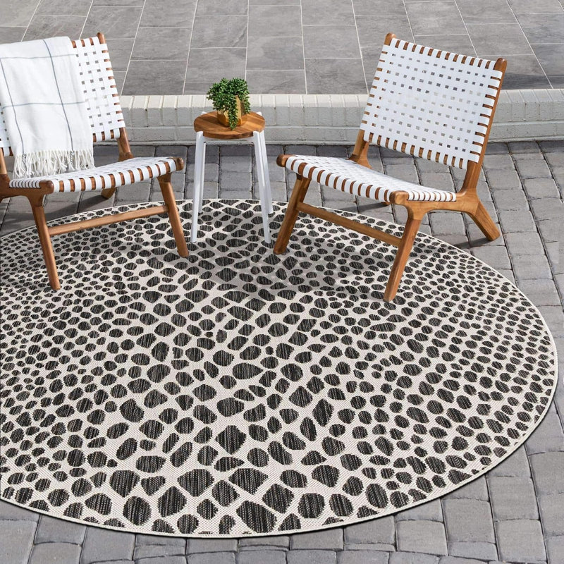 Tapis unique de la collection Outdoor (rond 4 pi 1 po, noir / ivoire)