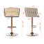 Ensemble de 2 tabourets de bar pivotants modernes à hauteur réglable - Tabourets de comptoir rembourrés en velours ivoire avec structure en métal doré et repose-pieds chromé pour îlot de cuisine