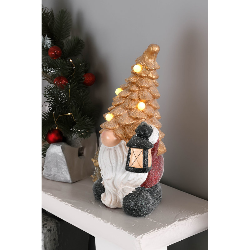 Gnome du crépuscule avec chien et lanterne