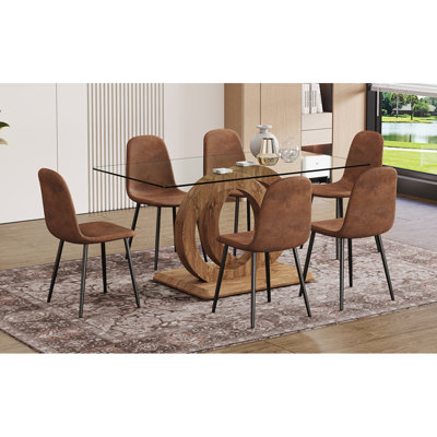 Ensemble de 1 table et de 4 chaises. Table de salle à manger rectangulaire en verre trempé transparent de 63 po x 35,4 x 30 po avec support en bois aggloméré en bois aggloméré de couleur oc. Assorti de 4 chaises de salle à manger en tissu brun.