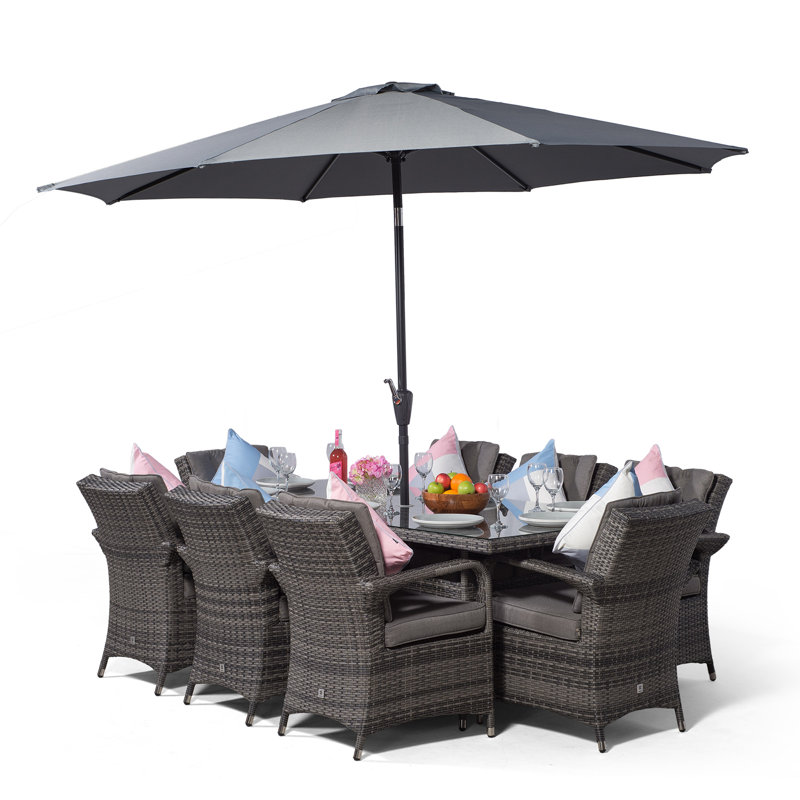 Karas 8 - Person Wicker Patio Dining Set with Rectangular Table , Cushions Included