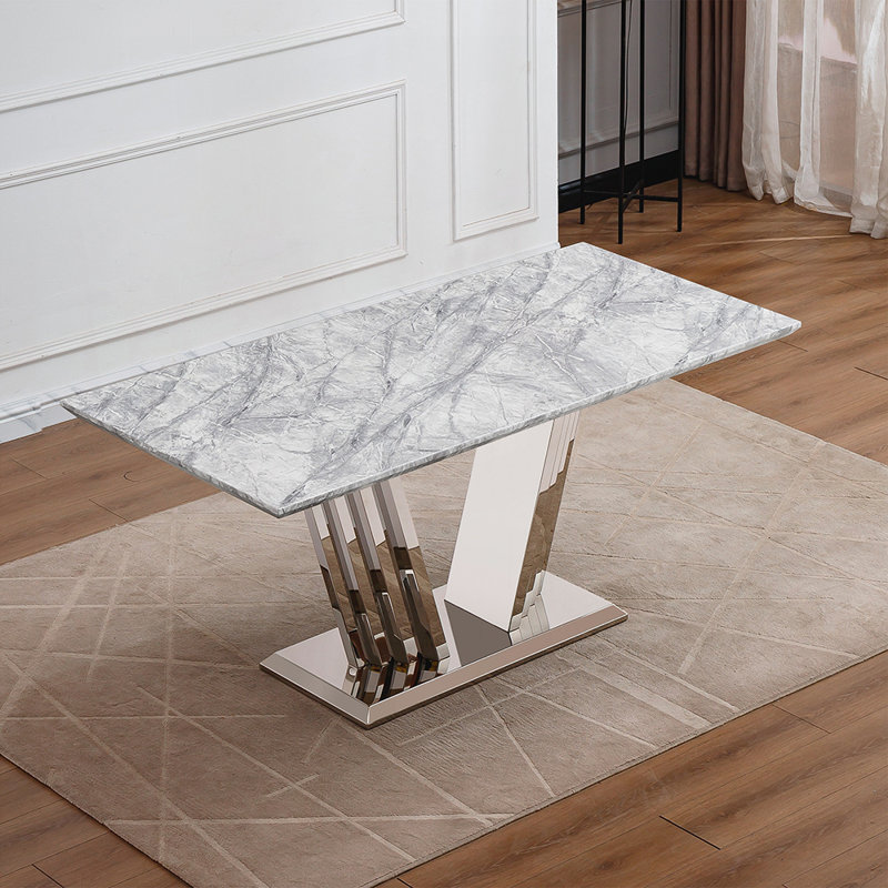 Table de salle à manger moderne à dessus en marbre avec base en acier inoxydable chromé, idéale pour un décor élégant et polyvalent