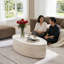 Table basse moderne ovale, finition pierre beige clair pour le salon