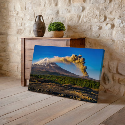 Canvas A Majestic Volcano Erupts In The Foreground Its Snow Capped Wall Art Peak Contrasting With The Dark Rugged Slopes Below Plumes Canvas Wall Art