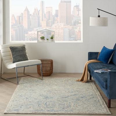 Tapis bleu / beige en laine touffeté à motif abstrait