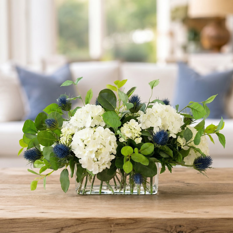 Hydrangea and Thistle Floral Arrangement in a Rectangular Glass Vase