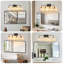 Éclairage pour salle de bain 4 lumières Mid-Century moderne avec élégants globes en verre transparent noir mat et or-129899852