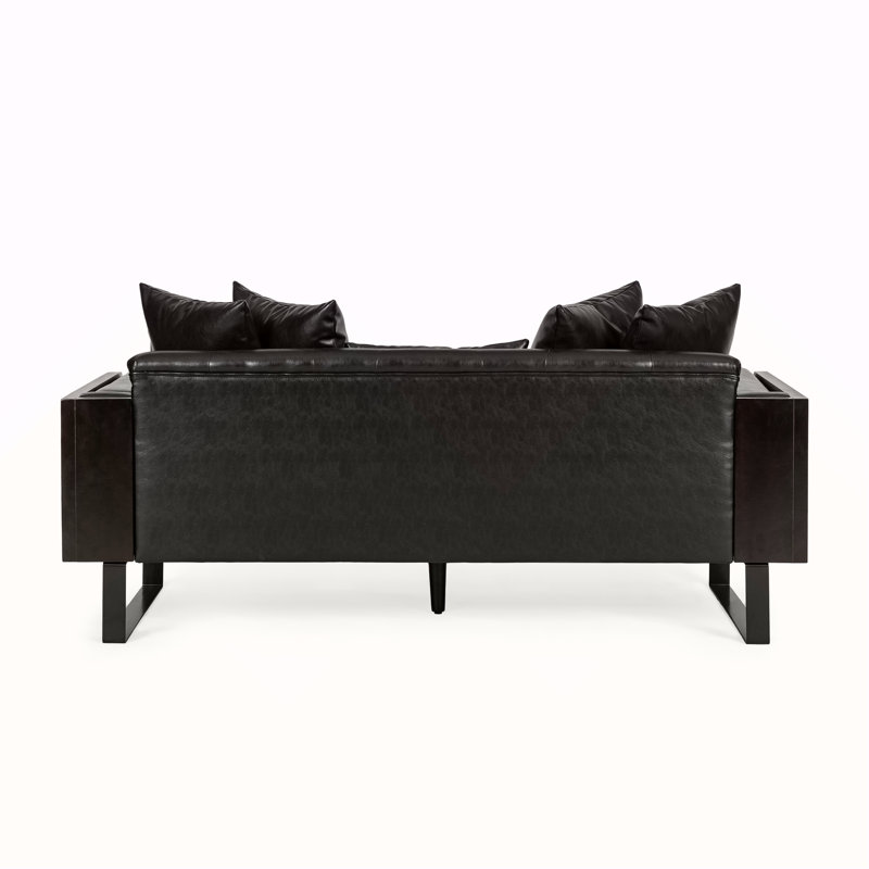 Causeuse contemporaine en similicuir avec port USB, appui-tête réglable et accoudoir de rangement pour un confort et un style modernes.