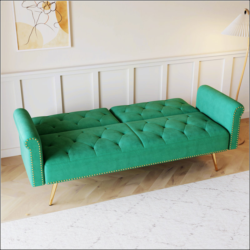 Luxurious Green Velvet Sofa Bed With Nail Head Trim And Matching Throw Pillow For Elegant Comfort