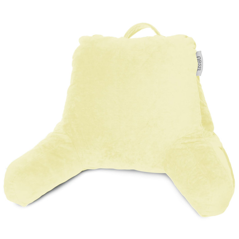 Reading back pillow in yellow velvet with a top carrying handle.