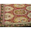 Remarquable couleur de fond rouge-rubis avec bordure noire et motif médaillon / écusson antique de style Karabagh rond 9 pi 3 po