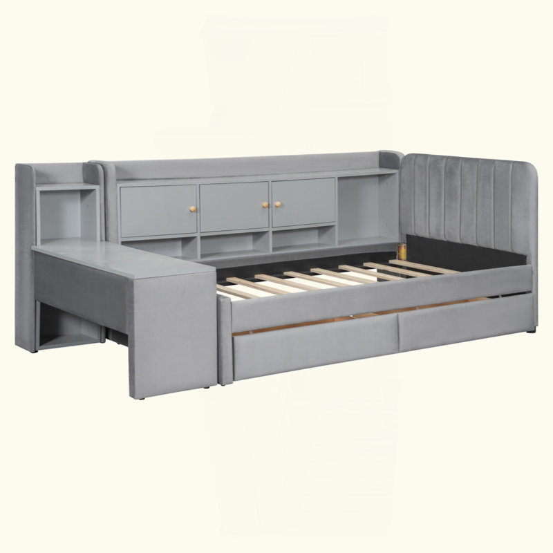 Lit de jour rembourré avec tiroirs, tablettes, armoires rabattables et table d'appoint