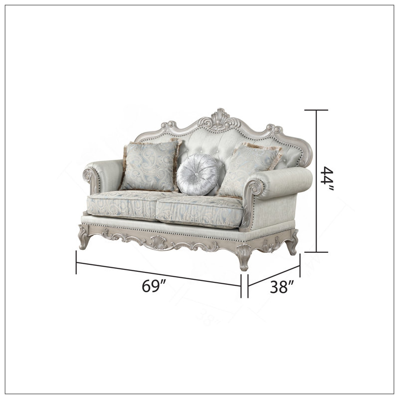 Causeuse de style traditionnel avec capitonnage coordonné, structure en bois durable et finition grise chic pour une élégance intemporelle.